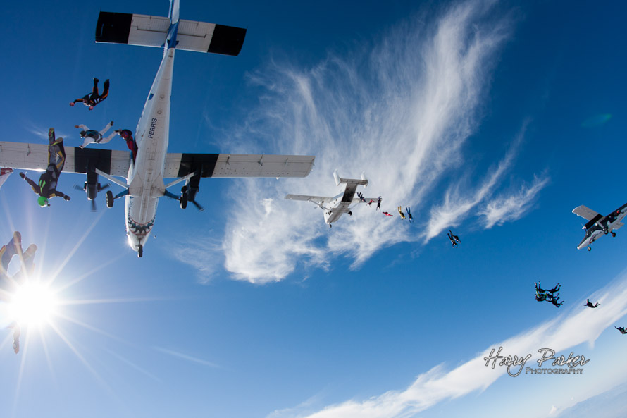 Skydivers exit multiple plane formation over skydive perris, photo by harry parker